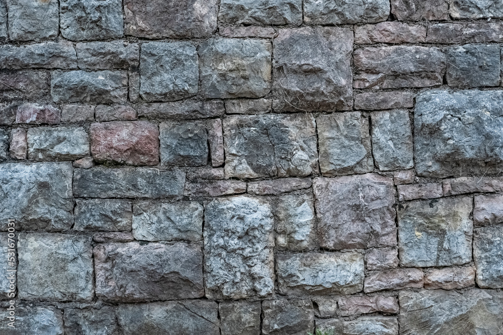 texture of a grey stone wall made of stones with concrete texture of a grey stone wall made of stones with concrete