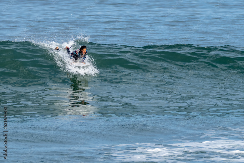 Surfer girl riding a wave Surfer girl riding a wave