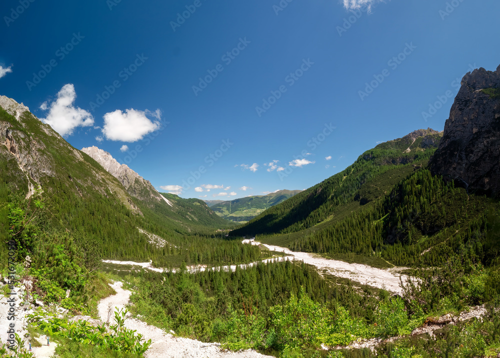 Panoramic hiking trail along the Tirol Sexten mountain chain during summer time
