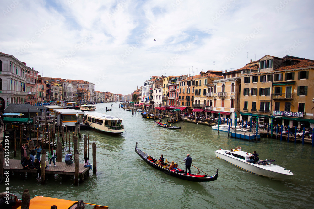 Fototapeta premium People enjoying gondola ride in Venice, Italy