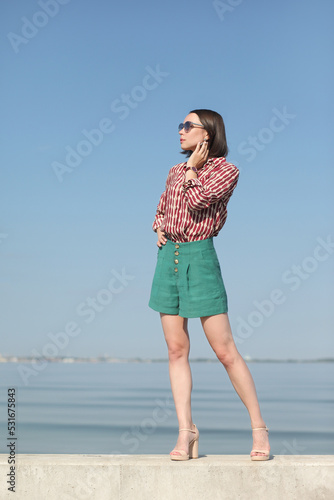 young slender woman by the sea