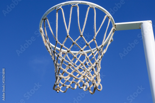 netball hoop against blue sky © Veronica