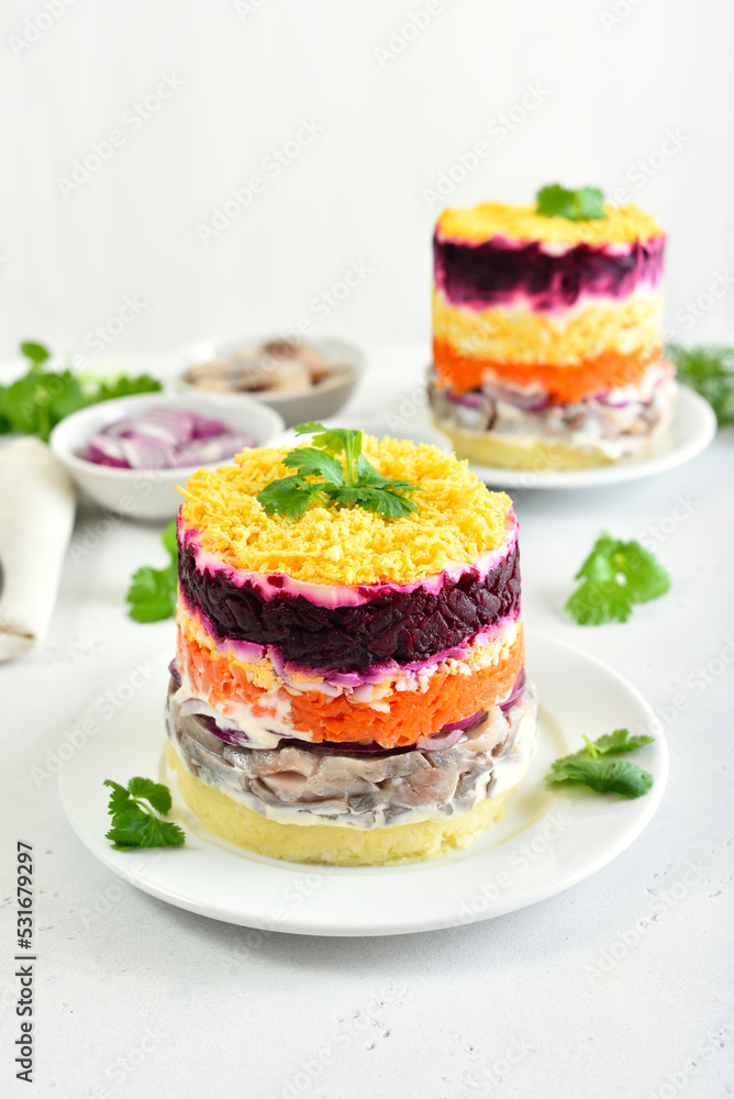 Layered salad with beet, herring, carrots and potatoes Layered salad with beet, herring, carrots and potatoes