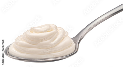 Sour cream in spoon isolated on white background