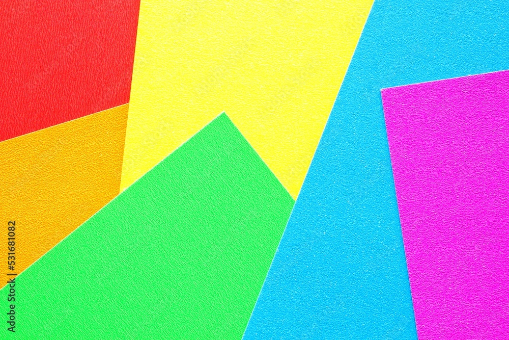 Abstract creative texture geometric pattern from craft paper background. Rainbow lgbt colors. Structure design cardboard poster shape backdrop. Top view with copy space for text, flat lay, close up Abstract creative texture geometric pattern from craft paper background. Rainbow lgbt colors. Structure design cardboard poster shape backdrop. Top view with copy space for text, flat lay, close up