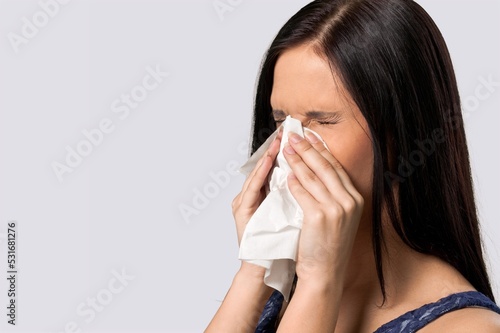 Young sad woman feel sick using tissue paper