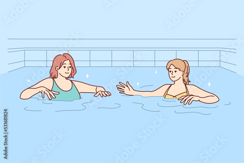 Women in swimsuits have fun in swimming pool together. Female friends in bikini swim in water in indoor pool. Hobby and recreation. Vector illustration. 