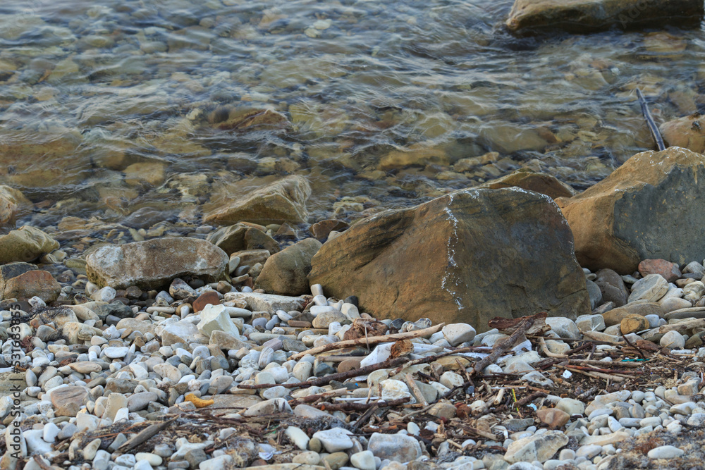 a big stone in the sea, which is washed by waves
a big stone in the sea, which is washed by waves