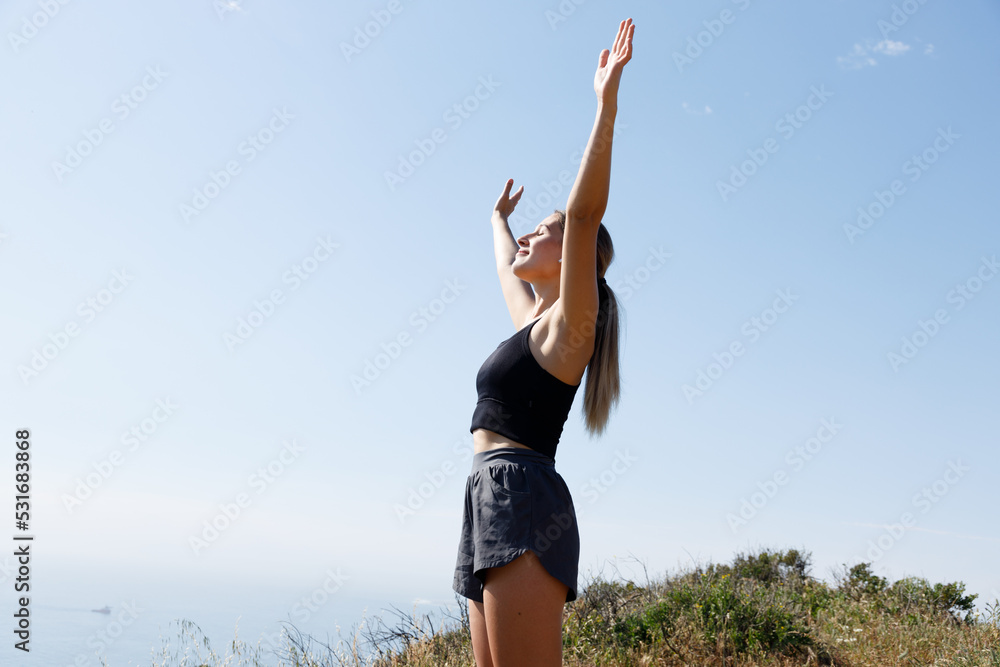 strong confident woman hiker open arms at on mountain peak rock strong confident woman hiker open arms at on mountain peak rock