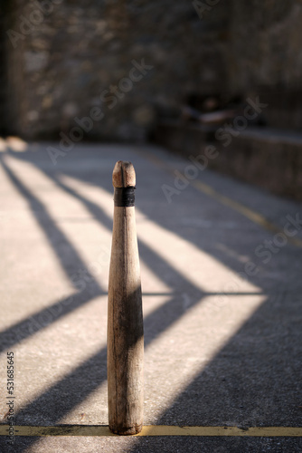 Close-up of a traditional Spanish (Asturias) style wooden candle shaped bowling pin.