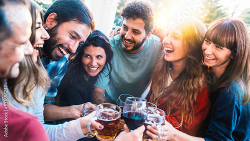 Fotografia, Obraz Happy young people enjoying happy hour drinking at bar restaurant terrace - Grou