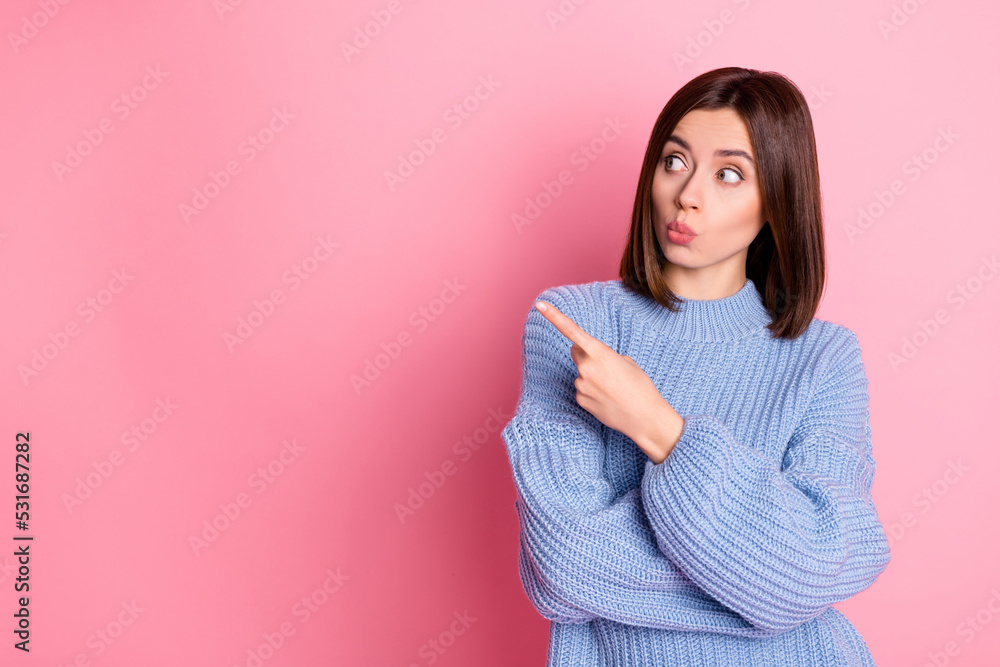 Fototapeta premium Portrait of impressed pretty lady look indicate finger empty space isolated on pink color background