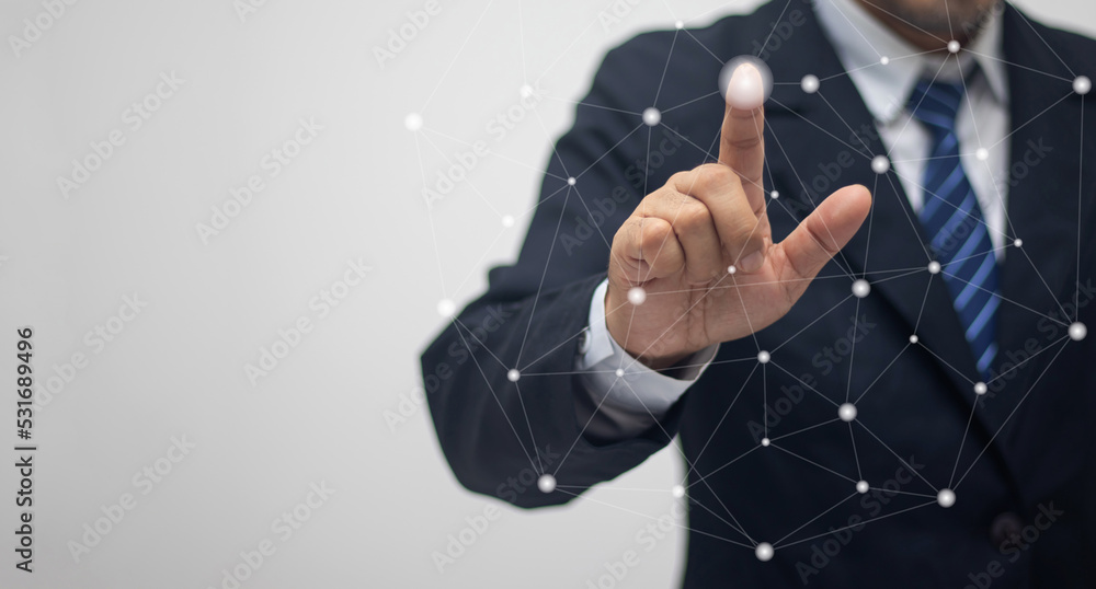 Businessman touching the connection point with his finger Businessman touching the connection point with his finger