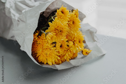 Chrysanthemum bouquet in kraft paper