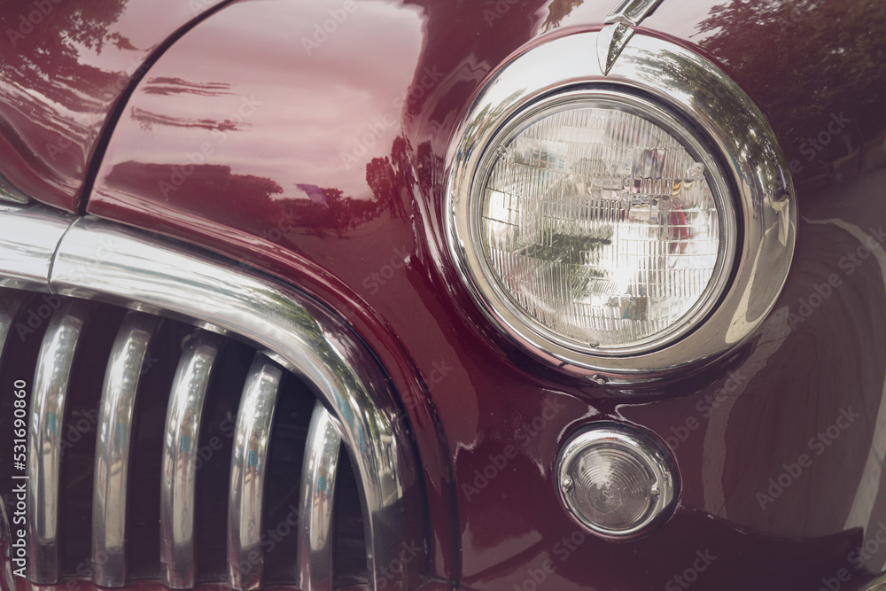 Detail of a vintage car. Close up of headlight retro classic car. Vintage effect style pictures. Classic car.