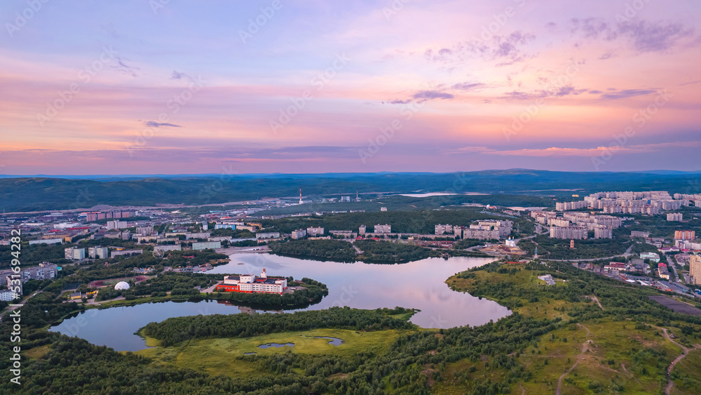 Murmansk, Russia - July 16, 2022: Aerial view panorama of city and port of Nord sea sunset