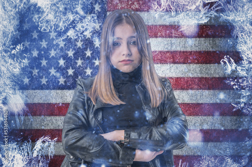 Teenage girl on frozen background with flag of United States of America. Concept of crisis in USA in winter. Energy crisis.