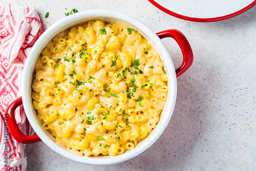 Mac and cheese in red pot. Traditional American food. photo