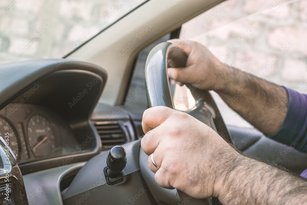 Man driving a car. Person drives a right-hand drive car in England, Japan or India. Man driving a car. Person drives a right-hand drive car in England, Japan or India.