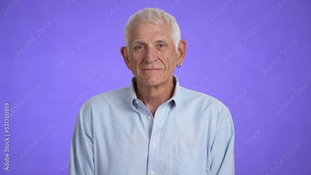 Portrait of smiling senior old man with gray hair looking at the camera. Happy elderly man smiling. Grandpa is happy to live, a healthy lifestyle. Close-up Portrait of smiling senior old man with gray hair looking at the camera. Happy elderly man smiling. Grandpa is happy to live, a healthy lifestyle. Close-up