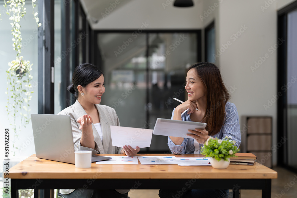 Asian business adviser meeting to analyze and discuss the situation on the financial report in the meeting room.Investment Consultant, Financial advisor and accounting concept Asian business adviser meeting to analyze and discuss the situation on the financial report in the meeting room.Investment Consultant, Financial advisor and accounting concept