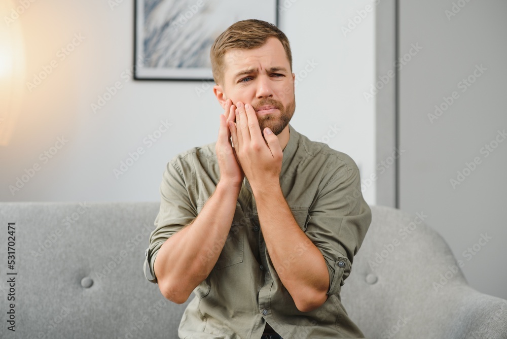 Dental health problems concept. Man suffering from strong toothache. Dental health problems concept. Man suffering from strong toothache.