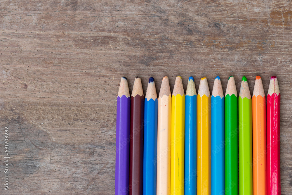 blunt coloured pencils on wood floor. blunt coloured pencils on wood floor.
