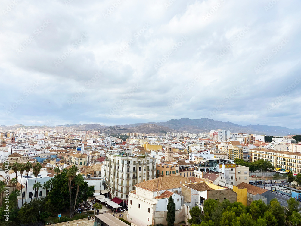 high angle view of the city from Alcazaba de Malaga on a cloudy day. one of the most famous attractions in Malaga, Spain. High quality photo