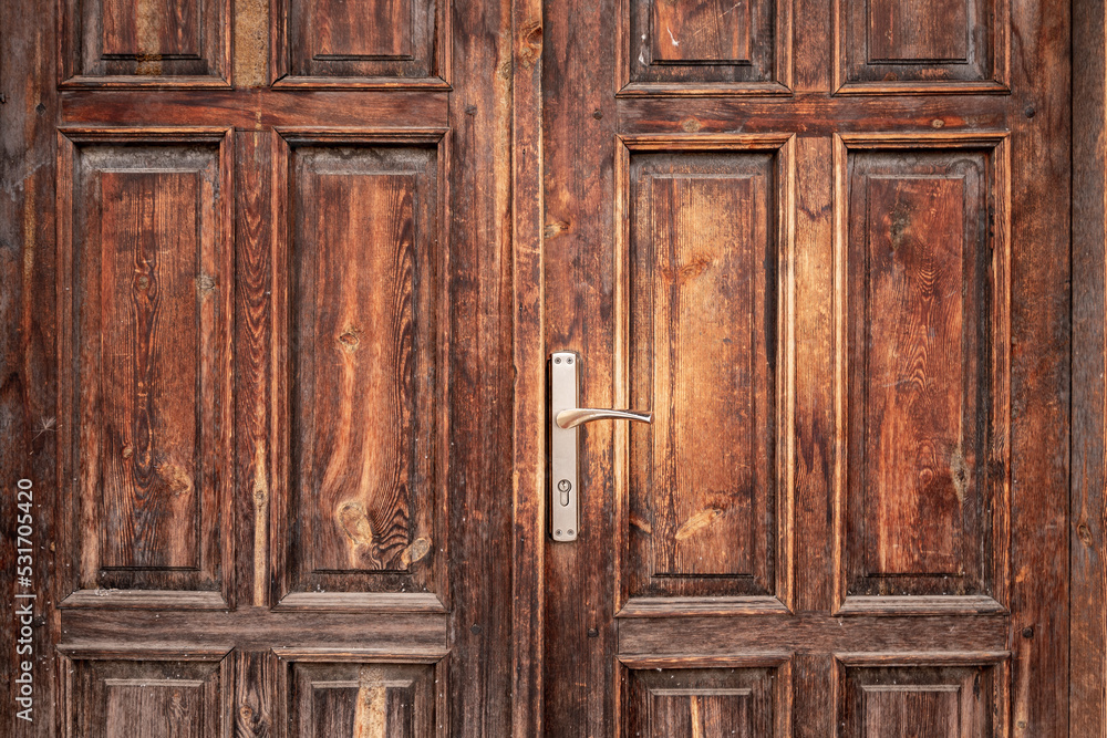 Old, rustic, classical, brown, wooden door with iron door handle. Door textures and background. Old, rustic, classical, brown, wooden door with iron door handle. Door textures and background.