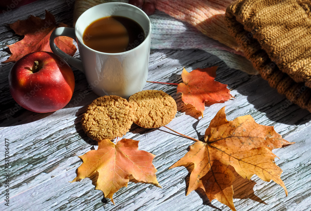 Cup of coffee with autumn leaves and apple Cup of coffee with autumn leaves and apple