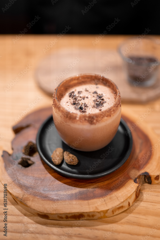 Cup of Champurrado on table Cup of Champurrado on table