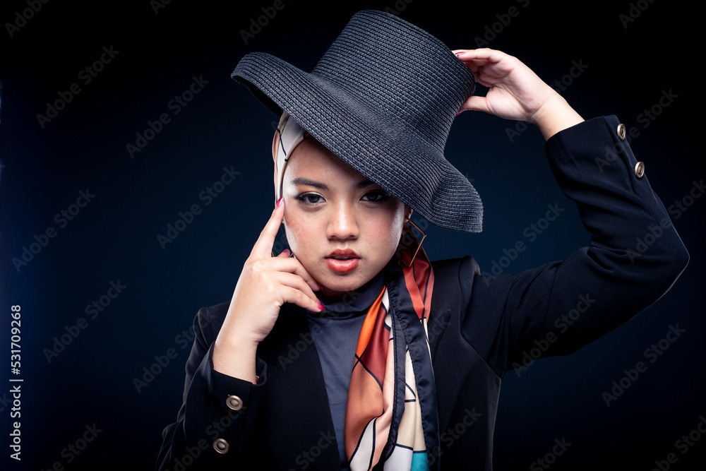 Portrait of a beautiful female Muslim model wearing hijab, a lifestyle apparel for Muslim women isolated from background. Modern hijab fashion concept. Portrait of a beautiful female Muslim model wearing hijab, a lifestyle apparel for Muslim women isolated from background. Modern hijab fashion concept.