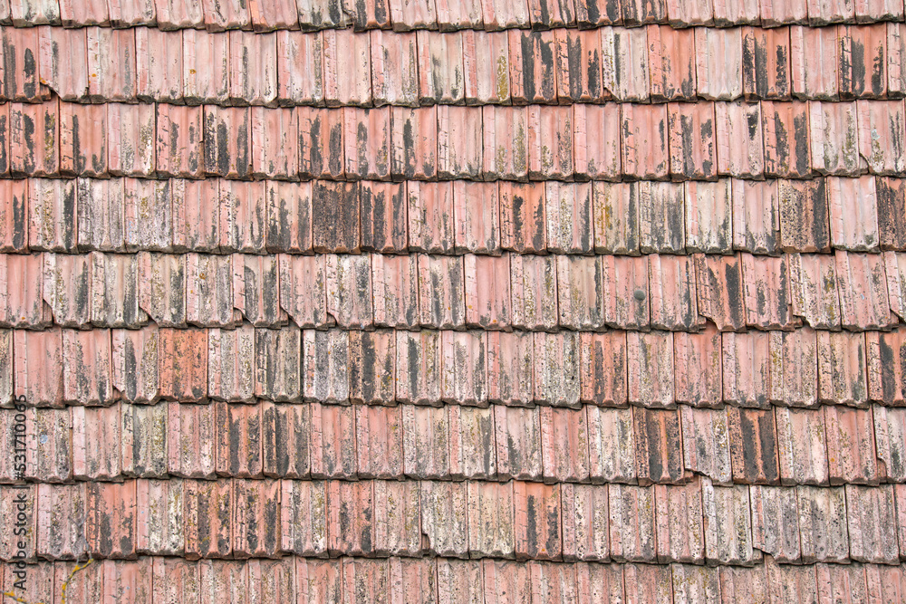 Closeup surface of old weathered ceramic tiles covering building roof Closeup surface of old weathered ceramic tiles covering building roof