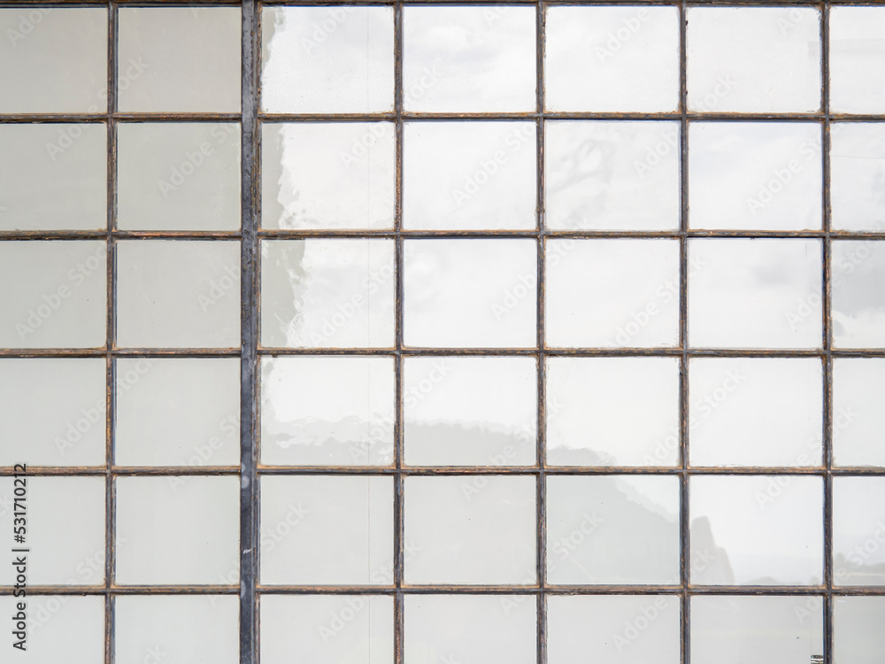 Pattern of seamless square glass window background texture. Geometric bright frame in minimalist house. Symmetry backdrop abstract. Repetition structure wallpaper. Pattern of seamless square glass window background texture. Geometric bright frame in minimalist house. Symmetry backdrop abstract. Repetition structure wallpaper.