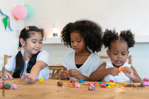 One Asian , Two African American little child girl playing together at home. Happy children girl having fun together