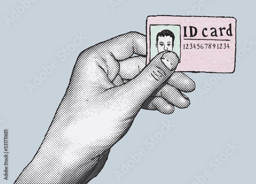 Hand holding ID card