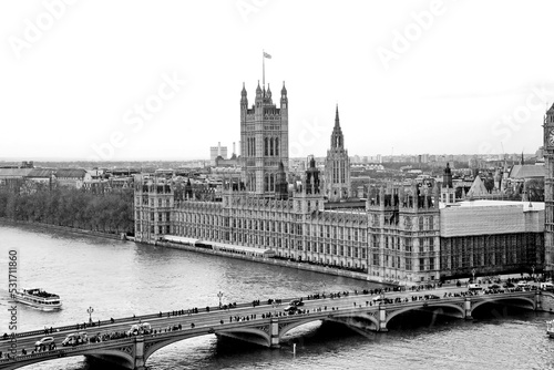 High angle view of a historical building and the river in black and white. Landscape view UK parliament building from The London Eye cabin.