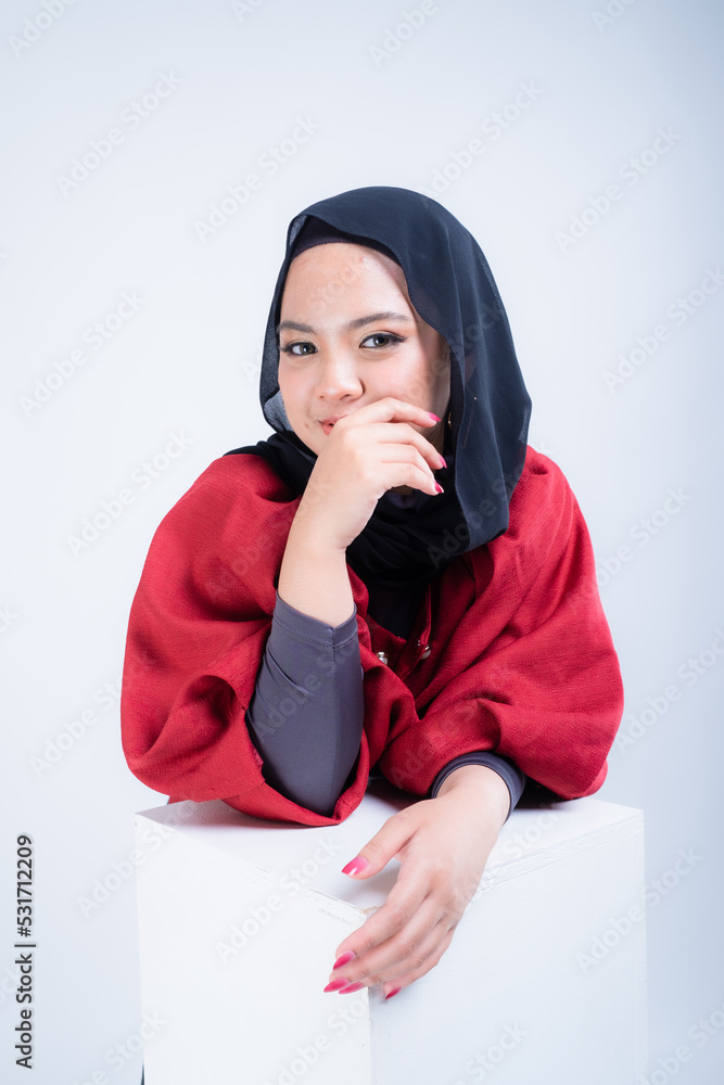 Portrait of a beautiful female Muslim model wearing hijab, a lifestyle apparel for Muslim women isolated from background. Modern hijab fashion concept. Portrait of a beautiful female Muslim model wearing hijab, a lifestyle apparel for Muslim women isolated from background. Modern hijab fashion concept.