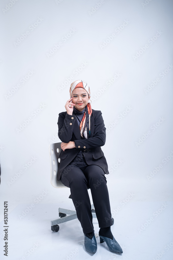 Portrait of a beautiful female Muslim model wearing hijab, a lifestyle apparel for Muslim women isolated from background. Modern hijab fashion concept. Portrait of a beautiful female Muslim model wearing hijab, a lifestyle apparel for Muslim women isolated from background. Modern hijab fashion concept.