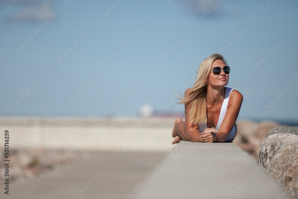 young slim woman in white bodysuit young slim woman in white bodysuit