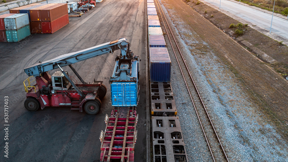 Aerial view crane loading container from container truck to container