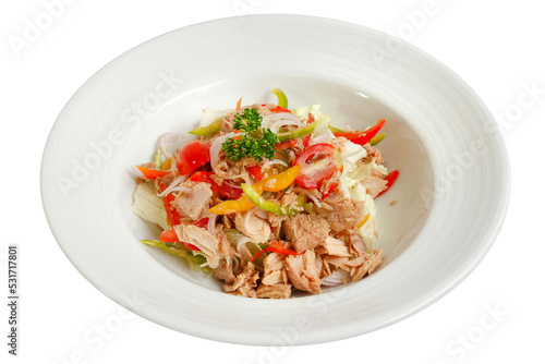 Green salad with canned tuna topped sliced green and red pepper.