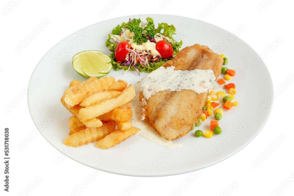 Grilled fish fillet steak with french fries and vegetables butter. coleslaw and cherry tomatoes, lime.