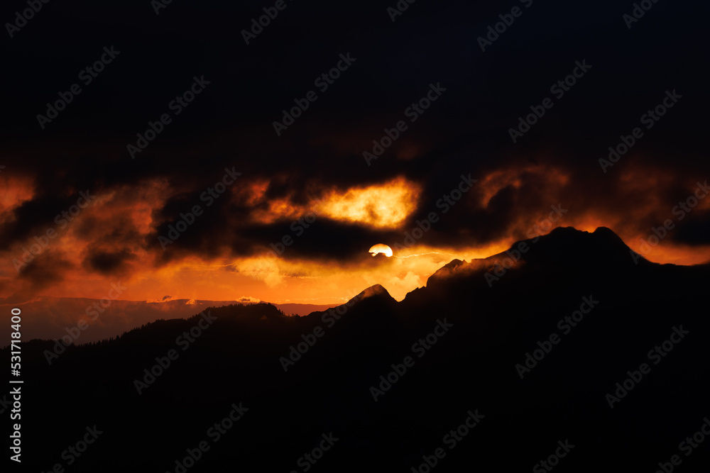 dramatic firy sunset in the fribourg alps