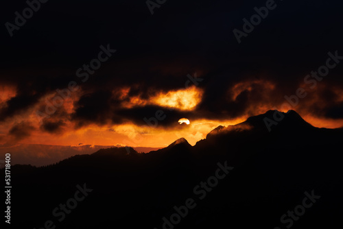 dramatic firy sunset in the fribourg alps