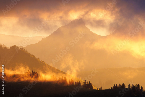 dramatic sunset with clouds in the Alpine foothills of Fribourg