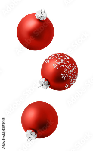 Christmas ornaments isolated on white background. Set of three falling red christmas balls photo
