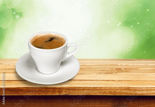 Cup of fresh aroma coffee on wooden table