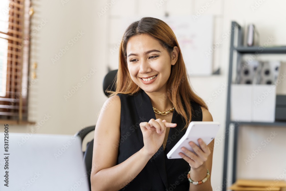 Attractive Asian business accounting working in office workplace, online planning successful business growth process. Attractive Asian business accounting working in office workplace, online planning successful business growth process.