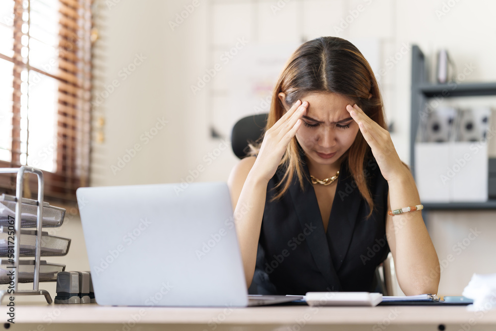 Depressed tired asian businesswoman, stressed at office workplace. Depressed tired asian businesswoman, stressed at office workplace.